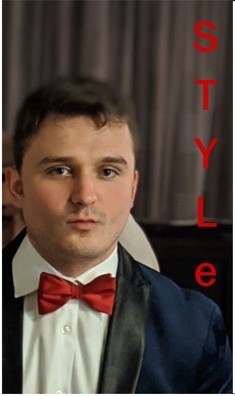 A man wearing a navy-blue suit and red bow tie