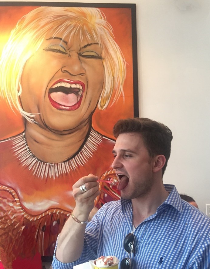 A man eating a cup of ice cream 